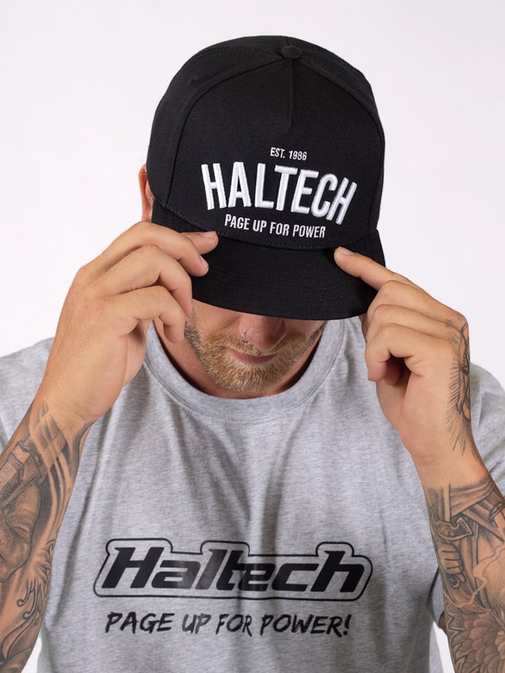 Haltech Snap Back Black with White Text Size: One size fits all.